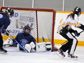 Kristin Looby (4) of the Mitchell U16’s scores on Goderich goalie Tyson Kovats during opening night action of the 30th annual Mitchell Stingers ringette tournament last Thursday. ANDY BADER/MITCHELL ADVOCATE