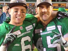 Kingston natives Rob Bagg, left, and Mike McCullough celebrate following the Saskatchewan Roughriders' Grey Cup victory over the Hamilton Tiger-Cats Sunday night in Regina. (Laura McCullough)