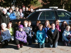 Monsignor O'Neil's 2013-14 Grade 6 V.I.P. (Values, Influences, Peers) class gather around the OPP cruiser with their VIP Officer, Constable Charlie Abdul-Massih.
Contributed Photo Courtesy of Jennifer Van Acker-Barlow