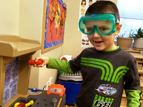Four-year-old Emmanuel plays with a construction set at the Bissell Centre's free daycare program on Nov. 26, 2013, in Edmonton Alta. Though the centre receives some of its funding from government, the daycare is one that depends a greater deal on fundraising. Dave Lazzarino/Edmonton Sun