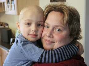Sylvie Gelinas holds her son Patrick, who was diagnosed with leukemia recently. A Christmas party this Saturday will raise donations for the Child Life Services program at KGH, which has been helping Patrick during his hospital stays.
Michael Lea The Whig-Standard