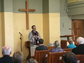 Rev. James Brown conducts the final service at Victoria Avenue United Church.