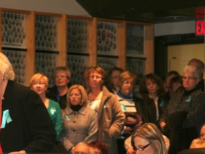 Hospice committee chair Jennifer Wilson addresses council on Nov. 25 backed by a standing-room-only crowd of supporters.