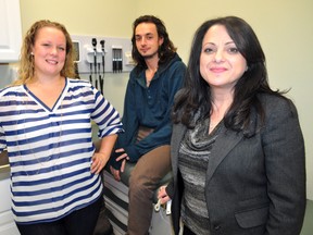 Joanna Rodger, YOU youth consultant (left), Clint Ruttan, a YOU Youth Action Centre user, and Mirella Bryant, YOU’s manager of transition services, inside the new primary health clinic at The Cornerstone in London Nov. 26, 2013. CHRIS MONTANINI\LONDONER\QMI AGENCY