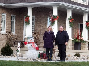 Kevin Van Damme, right, stands outside of his Otter Line house, which will be one of six houses featured on the Wallaceburg & Historical Society Christmas Home Tour on Dec. 1. Standing with him is his niece Julie Van Damme of All Seasons Nursery and Flowers, which will professionally decorate the house, as all the homes on the tour will be professionally decorated by local businesses.