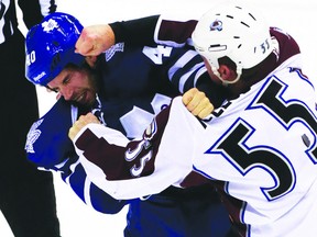 Toronto Maple Leafs forward and Portage la Prairie product Troy Bodie dukes it it out with Colorado Avalanche forward Cody McLeod last month. Bodie has since been sent to the AHL. (QMI Photo)