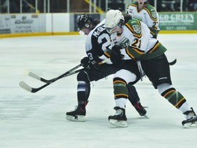 Portage Terriers forward Zack Waldvogel fights for a loose puck duing the Terriers' game against Steinbach Nov. 27. (Kevin Hirschfield/THE GRAPHIC/QMI AGENCY)
