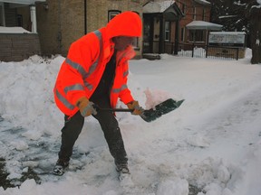 Many St.Thomas residents are still digging their way out of the more than 60 cm of snow that fell over the weekend. Paul Berdan clears the snow out front of his Centre Street home. Don't put the shovels away just yet. Environment Canada warns we could receive another 30 cm into Thursday.