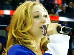 A screen grab shows Jill Shackner attempting to perform the Canadian national anthem on Wednesday night.