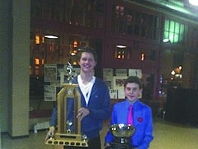 Portage la Prairie cyclists Willem Boersma, left, and Kailen Shackleton, right, pose with their hardware won at the Manitoba Cycling Association's awards banquet earlier this month. (Submitted photo)