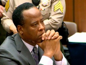 Dr. Conrad Murray listens as Judge Michael Pastor sentences him to four years in county jail for his involuntary manslaughter conviction of pop star Michael Jackson in this screen grab from pool video in Los Angeles November 29, 2011. (REUTERS/CNN/Pool)