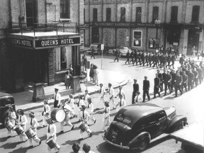 A parade past the old Queen?s Hotel in Strathroy is among the pictures and stories included in a new book, Tales of our Town: Strathroy and Area Stories, published by the historical society. The book launch is Wednesday. (Museum Strathroy-caradoc Photo)