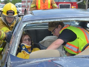 Memorial Composite High School students participated in a mock crash in May 2013 to help raise awareness of the dangers of drinking and driving. - Thomas Miller, Reporter/Examiner