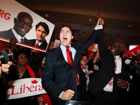 Liberal leader Justin Trudeau celebrates the byelection victory of  Liberal candidate Emmanuel Dubourg in the Bourassa riding in Montreal on November 25.  
CHRISTINNE MUSCHI/REUTERS