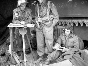 Unidentified personnel of the Canadian Armoured Corps using wireless signal information to plot enemy movements in the Normandy beachhead, France, June 6, 1944. 
Library and Archives Canada/Ken Bell
