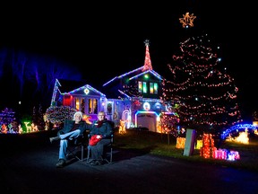 Dennis Taylor and Raymie Jewell have more than 65,000 Christmas lights on and around their home in Port Stanley, Ontario. (QMI Agency file photo)