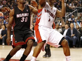 Norris Cole of the Miami Heat (left) pressures as Raptors’ Kyle Lowry tries to get a shot off during Friday night’s game in Toronto. (MICHAEL PEAKE/TORONTO SUN)