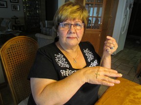 Esther Waybrant holds a necklace that belonged to her mother. It was one of the few pieces of jewelry returned to the St. Clair Township woman following a break-in this fall. PAUL MORDEN / THE OBSERVER / QMI AGENCY