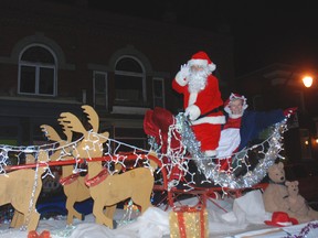 Santa and Mrs. Claus wave to the crowd at the West Lorne Santa Claus parade.