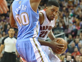 Rudy Gay of the Raptors looks for room to move against Nuggets' Darrell Arthur on Sunday at the ACC. The Raps got off to a quick start before the Denver bench did its thing, leading the visitors to a a 112-98 win. (Mark Konezny, USA Today Sports)