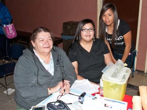 (l-r) Marlene Provost, Ann McDougall and Celia Bad Eagle demonstrate the importance of proper nutrition and offer free blood pressure and diabetes screening at the Piikani Health Fair. Bryan Passifiume photo/QMI Agency