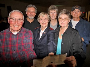 Salvation Army Pastor Starr Ferris (front and centre) was pleased to accept a $1,300 cheque for Christmas initiatives from Larry Donnelly (front left) and Sharon Brinn (right) Saturday evening during the Tri-County Jamboree in the Avondale United Church lower hall. In the back row, are: Oliver Gauld, Elaine Gauld and Don Brinn. Jeff Tribe/Tillsonburg News