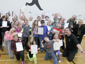 Grade 5 Evergreen students strike a goofy pose last week after receiving their John Muir Awards.