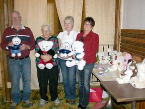 Members of the Drayton Valley District Cancer Support Group stand with some of the teddy bears they will be giving to residents of local seniors’ lodges as part of their annual teddy bear program. The well-loved initiative brings those who are ill and seniors a new fuzzy friend and care package to help brighten their holidays. LEFT TO RIGHT: Howard Olsen, Fern Barnay, Jeanne Gaudet and Eileen Linde.