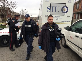 Durham Regional Police officers work at the scene of a police shooting in Ajax on Monday afternoon. (CRAIG ROBERTSON/Toronto Sun)