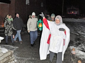 Sandy Kreis from Thamesview United Church in Fullarton leads a group of visitors through the various stops on the road to Bethlehem during the Christmas production of Bethlehem Live at Upper Thames Missionary Church in Mitchell on Friday evening. KRISTINE JEAN/MITCHELL ADVOCATE