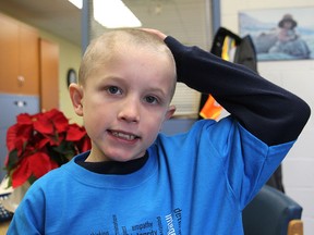 Jackson Sargeant, 10, a student at Loughborough Public School, just had his long hair cut so wigs can be made for needy children who lost their hair to cancer. (Michael Lea The Whig-Standard)