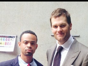 Joel Williams was fired from his job as a security guard in Houston after having his photo taken with Patriots QB Tom Brady. (Twitter.com)