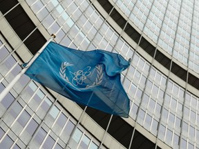 The flag of the International Atomic Energy Agency (IAEA) flies in front of its headquarters in Vienna November 13, 2013. (REUTERS/Heinz-Peter Bader)