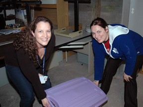 Starwood Hotels & Resorts Customer Contact Centre employees in St. Thomas volunteered at various business throughout the community on Tuesday as part of their Giving Tuesday event. Christine MacDonald, left, a program services associate, and Samantha Taylor, a quality monitoring associate, helped out at the Talbot Teen Centre, cleaning and re-organizing in the basement.