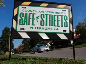 Safer Roads Ottawa and Ottawa Councillor Peter Hume handed out fliers last summer asking drivers to slow down in Alta Vista. Tony Caldwell/Ottawa Sun