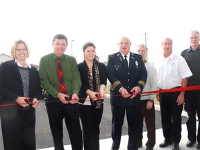 Ready to cut the ribbon to open the new Dutton ambulance station Wednesday were left, Karen Vecchio of Elgin-Middlesex-London MP Joe Preston's office, Elgin County Warden and Dutton/Dunwich Mayor Cameron McWilliam, Whitney McWilliam of Elgin-Middlesex-London MPP Jeff Yurek's office, Randy Denning, president of Elgin-St. Thomas EMS, Dave Marr, deputy mayor, Central Elgin, Paul Ens, mayor, Bayham and West Elgin Mayor Bernie Wiehle.