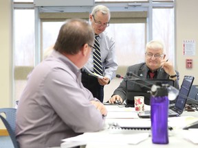 Frontenac Islands Mayor Denis Doyle and South Frontenac Mayor Gary Davison discuss Frontenac County's draft official plan at Wednesday's meeting.
Elliot Ferguson The Whig-Standard