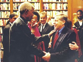 Nelson Mandela greets legendary newsman Ray Heard.