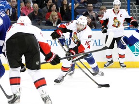 Ottawa Senators left wing Clarke MacArthur (16) shoots against the Tampa Bay Lightning during the first period at Tampa Bay Times Forum. Mandatory Credit: Kim Klement-USA TODAY Sports