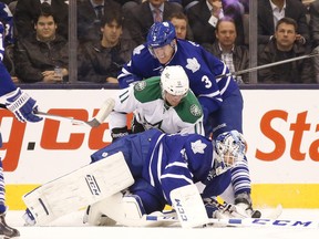 Maple Leafs' Jonathan Bernier dives for the puck during first-period action against the Dallas Stars in Toronto on Thursday. (Stan Behal/Toronto Sun)