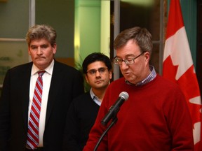 Ottawa Mayor Jim Watson is flanked by Ottawa South MPP John Fraser and Ottawa Centre MPP Yasir Naqvi at City Hall on Friday. Dec. 6, 2013. Watson met with Ottawa-area MPPs to discuss the second phase of LRT and the Ottawa River Action Plan. 
CHRIS HOFLEY/OTTAWA SUN/QMI AGENCY