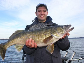 Eric Riley, of Ottawa, with his personal-best walleye, weighing more than 10 pounds, caught on the Bay of Quinte. (Supplied photo)