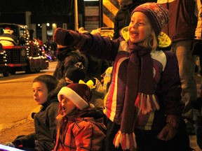 Lauren Birkbeck, 4, excitedly points out Harmony For Youth's float in the Sarnia Kinsmen Christmas Parade of Lights Saturday, as her cousin Max Schmidt, 3, right, looks on. The float, one of more than 60 in the annual parade down Christina Street in Sarnia, featured characters from Dr. Seuss' "How the Grinch Stole Christmas." People lined the streets Saturday evening as the parade wound its way down Christina Street from Exmouth to Wellington. Also pictured are Anne-Marie Santilli, 8, and her brother Shawn, 9. TYLER KULA/ THE OBSERVER/ QMI AGENCY