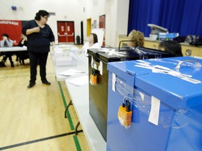 Electoral officer Kelly Maracle, left, instructs more than a dozen volunteers prior to counting ballots at Quinte Mohawk School in Tyendinaga, Ont. Sunday morning, Dec. 8, 2013. - JEROME LESSARD/The Intelligencer