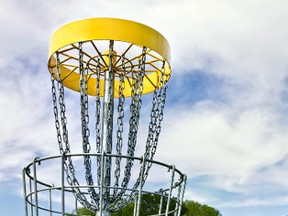 A disc golf net is pictured in this stock photo.