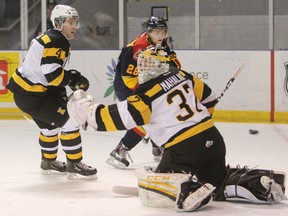 Kingston Frontenacs defenceman Michael Moffat watches Erie Otters forward Connor Brown score on Frontenacs goaltender Matt Mahalak during the first period of Sunday afternoon's game. (Elliot Ferguson The Whig-Standard)
