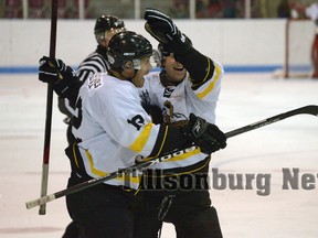 Tillsonburg Thunder's Travis Lisabeth celebrates his overtime game-winning goal Saturday night. CHRIS ABBOTT/TILLSONBURG NEWS