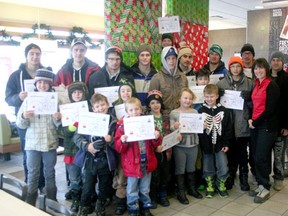 Members of the Evergreen School Ronald’s Readers program stand with their Drayton Valley Thunder buddies Dec. 4 after enjoying a pancake breakfast at McDonalds restaurant. The young readers all received certificates recognizing their achievements in the school literacy program.