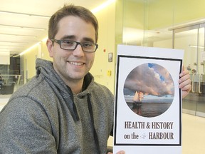 Queen's University medical student Branden Deschambault holds a poster promoting an annual conference of medical students he and his fellow students are hoping to bring to the city.
Michael Lea The Whig-Standard
