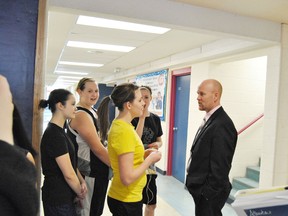 Jeff Johnson, Alberta’s education minister talks to a student during his visit to Whitecourt in February.
Barry Kerton | Whitecourt Star